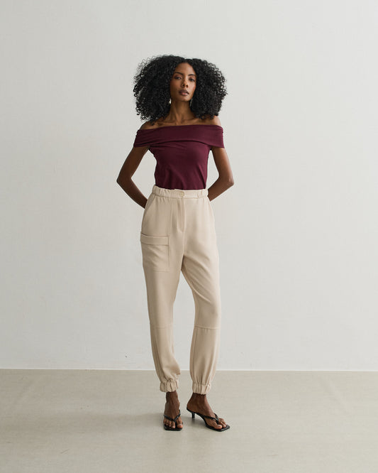 CALÇA COM ELÁSTICO BARRA E BOLSO LATERAL BEGE